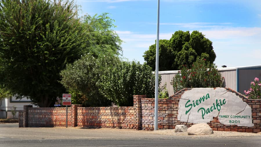 The Sierra Pacific Family Community entrance sign on Highway 95 in Yuma.